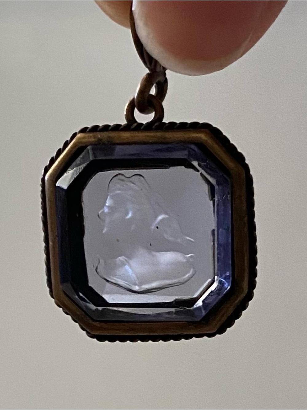 Extasia vintage intaglio pendant with a carved profile portrait.
